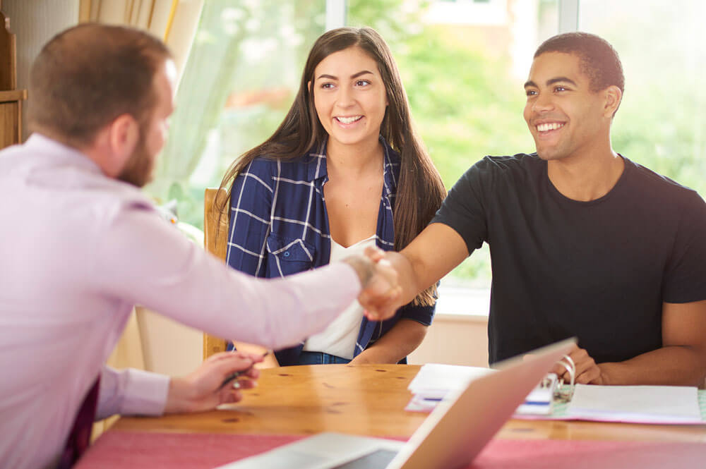 Man Shaking Hand With Real Estate Agent