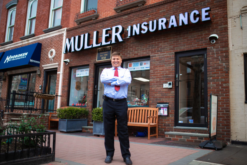 Roger Muller in front of office