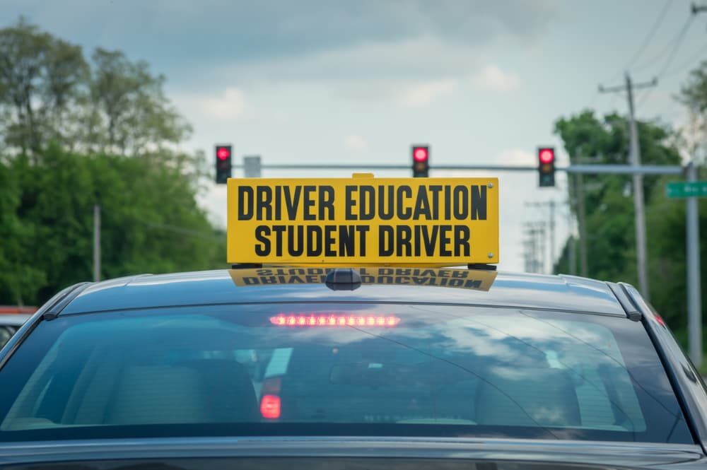 Student driver vehicle at stoplight