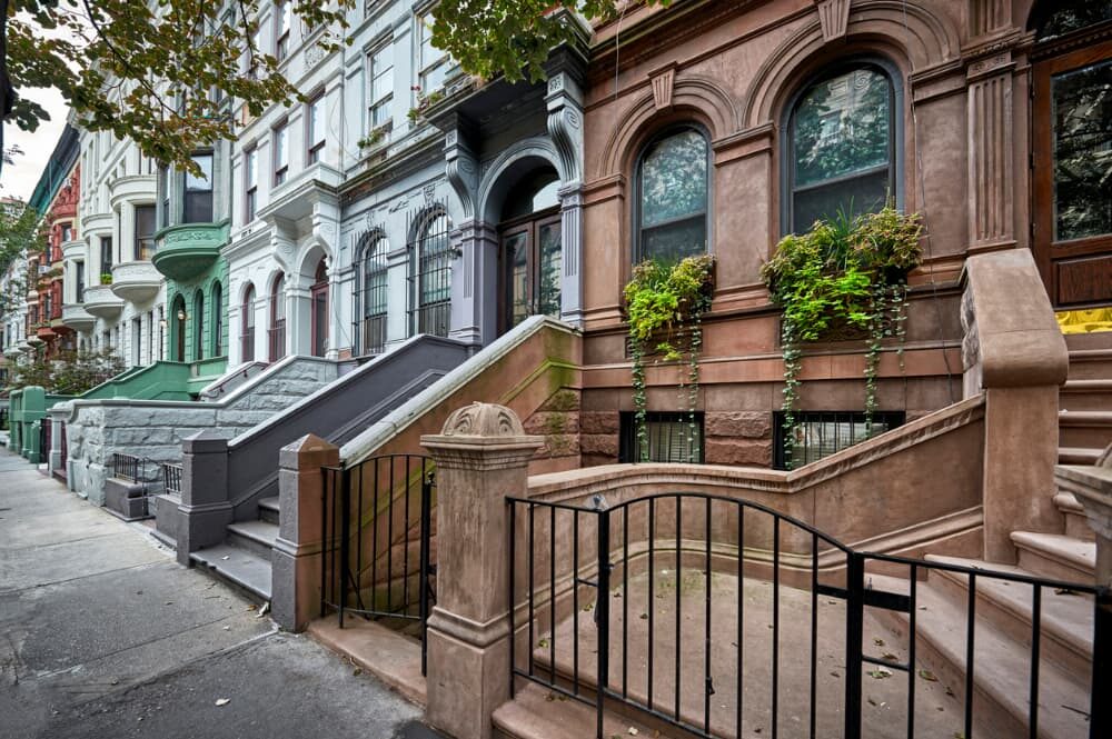 Exterior view of colorful row of brownstone homes