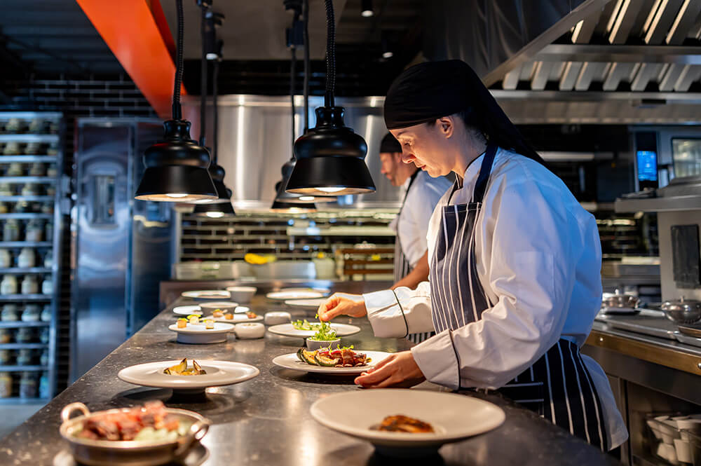 Chefs preparing meals at restaurant