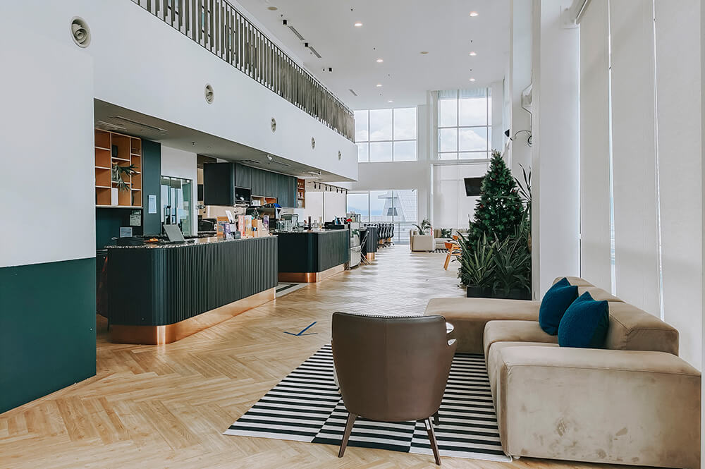 A condo in Jersey City. The shared common space with furniture, counters and tables.