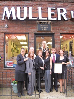 Muller Insurance Team in front of office building.