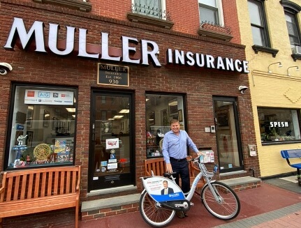 Roger J. Muller Jr. in front of Muller Insurance office in Hoboken NJ